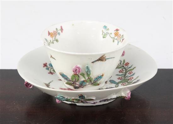 An unusual English soft paste porcelain polychrome teabowl and saucer, possibly Longton Hall c.1755-60, 12.4cm., repair to rim of teabo